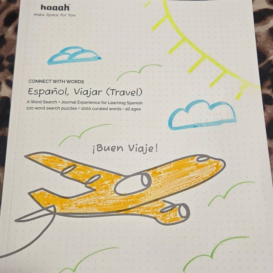 A reader's Español, Viajar cover, colored in by hand