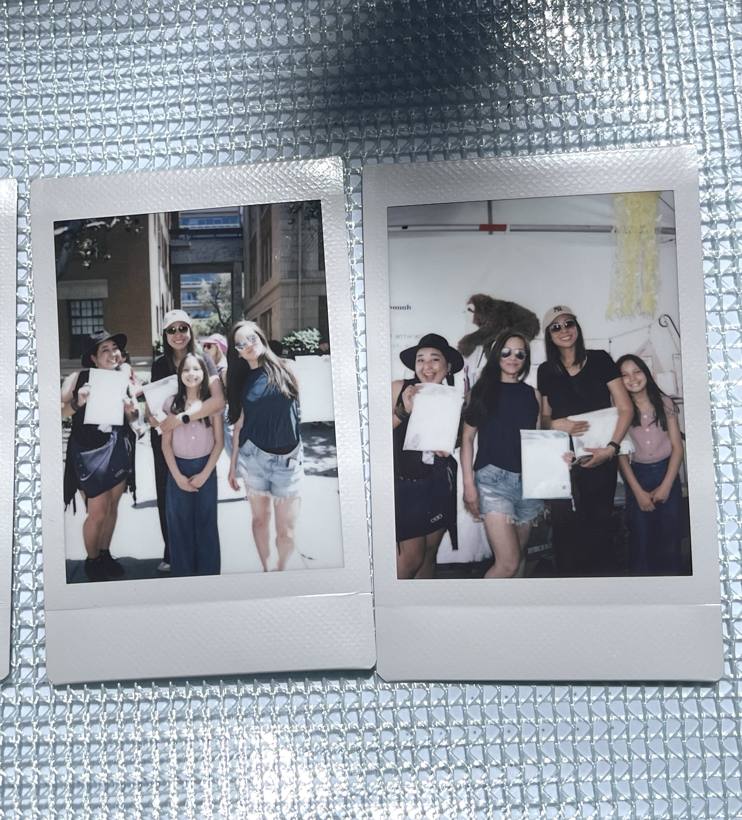 Instax photos pinned at the booth
